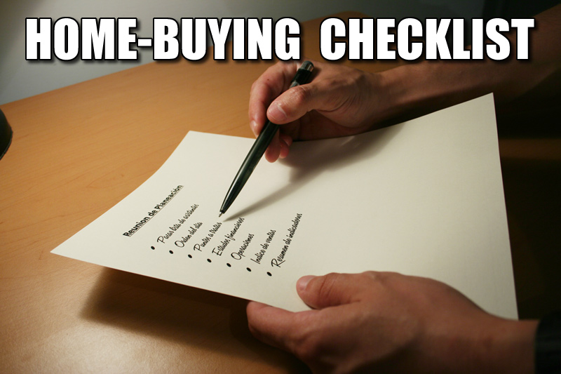 hands, Pen and checklist featuring the words"Home Buying Checklist"
