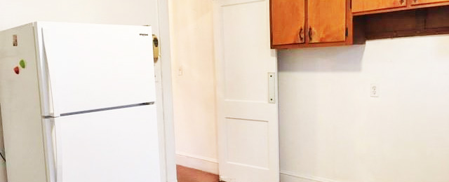 Refrigerator and kitchen of property located at 2305 Des Moines Avenue, Portsmouth, VA 23704